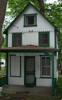 tiny cottage with large crocheted rug